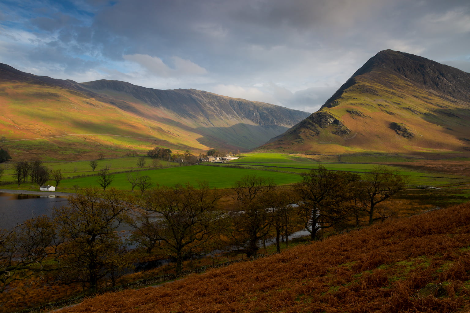 Gatesgarth Farm and Buttermere Fell at the southern end of Lake Buttermere in the Lake District.