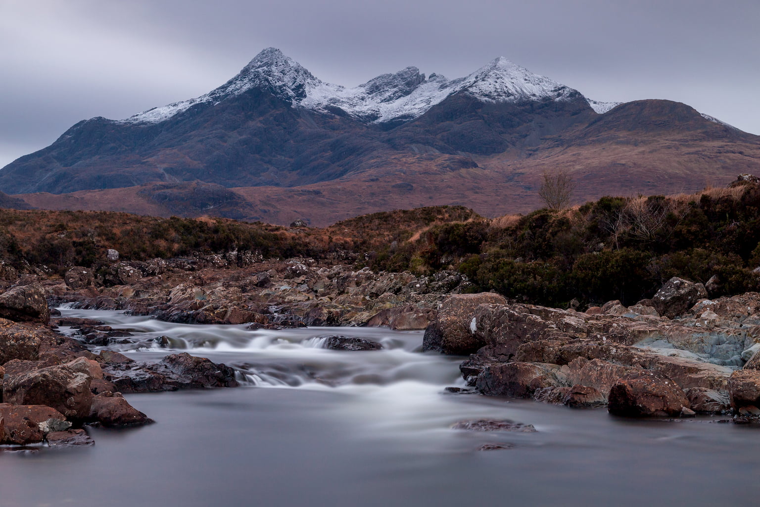 The Cuillin mountains towering over the Allt Deag Mor at Sligachan, Isle of Syke.