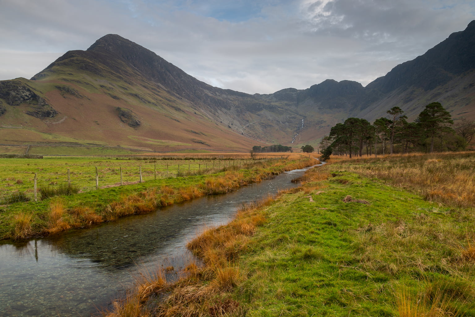 Warnscale Beck in the Lake Disrtict running through centre of landscape photograph with Fleetwith Pike on the left.